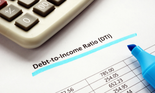 Debt to Income Ratio - picture of a calculator with papers and a pen